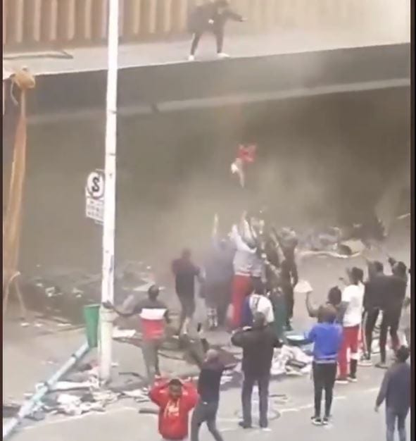 Toddler thrown from burning building in South Africa after looters