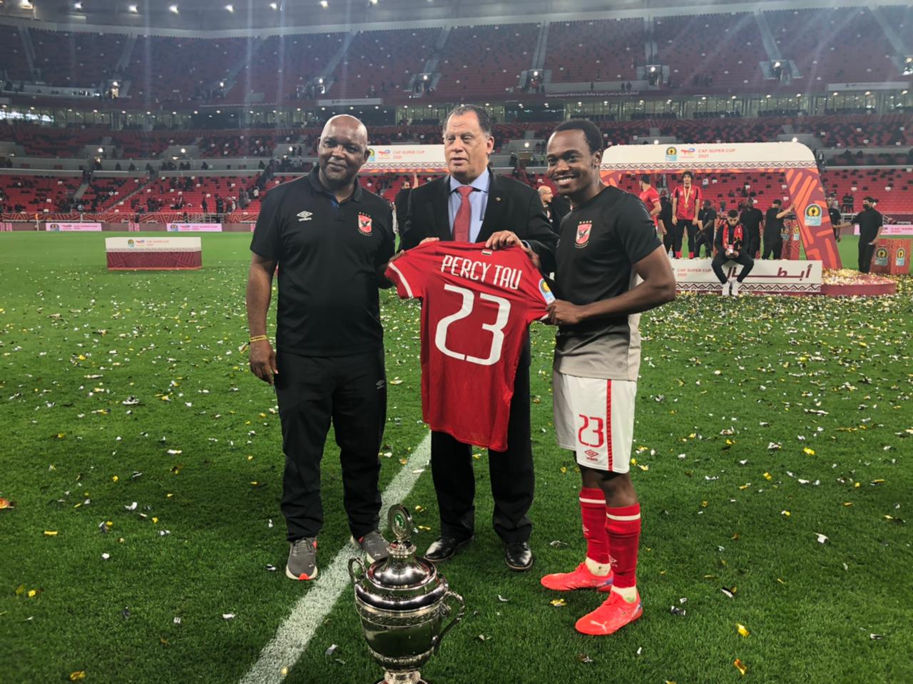 Danny Jordaan, the president of the South African Football Association with Percy Tau and Pitso Mosimane.