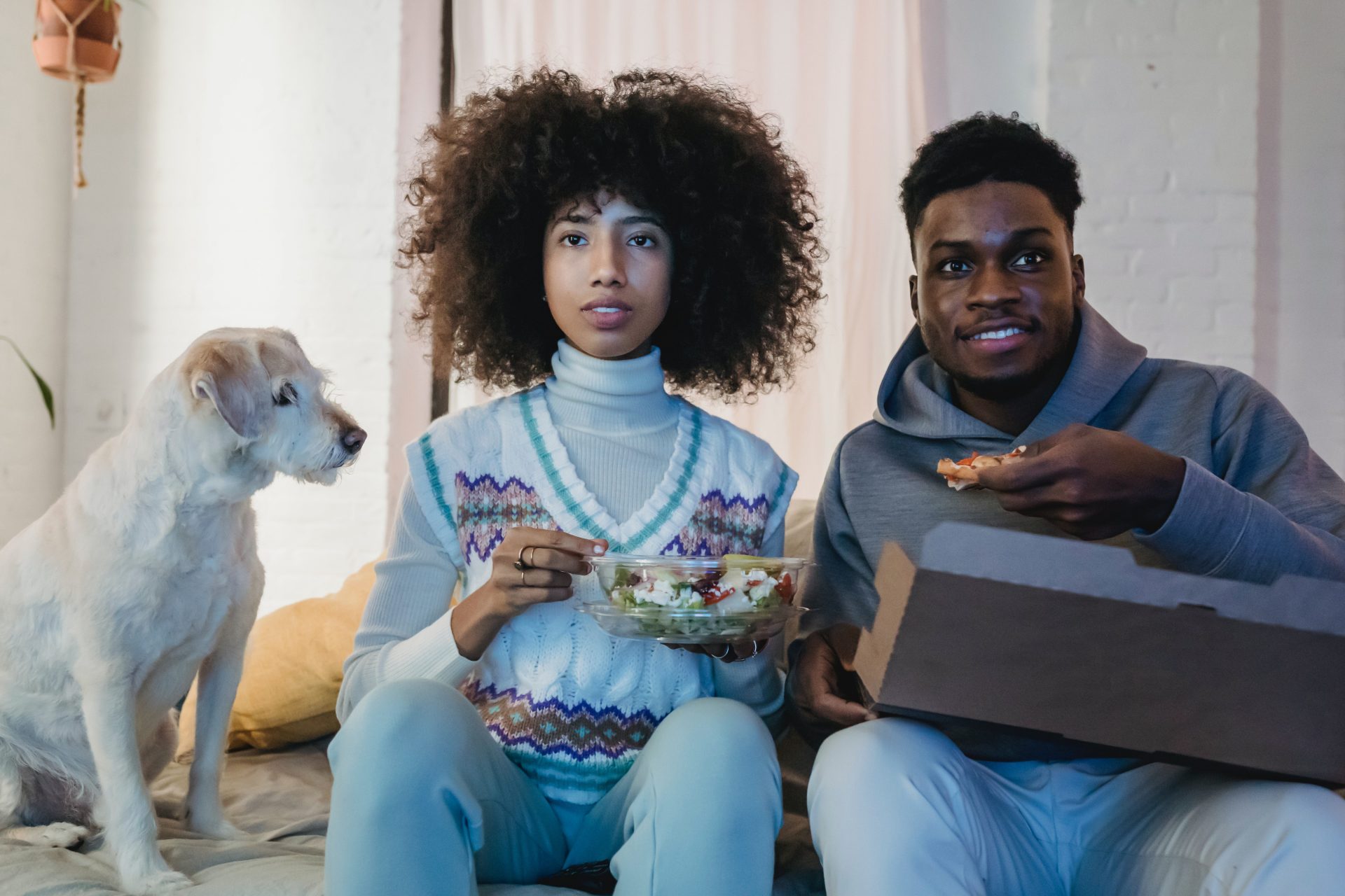 Watching a movie. Photo by Andres Ayrton from Pexels.