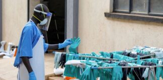 Uganda declares end to latest Ebola outbreak Ugandan worker collects a rubber glove from an airing line during a visit by the Director-General of the World Health Organisation at Mulago National Referral Hospital Isolation Unit.
