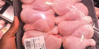 Packaged chicken portions displayed in a retail store representing rising staple food costs in South Africa.