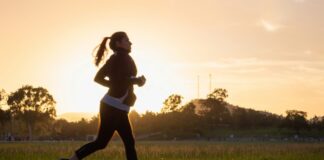 Woman jogging alone outdoors while exercising.